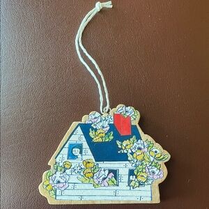 Charming Holiday House Ornament with Floral Design
